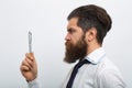 Business man in shirt and tie holding note pad and pen. Close up profile of surious man. Idea. Portrait of attractive Royalty Free Stock Photo