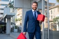 Business man with shopping bag. Handsome smiling confident businessman portrait. Royalty Free Stock Photo