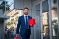 Business man with shopping bag. Handsome smiling confident businessman portrait. Royalty Free Stock Photo