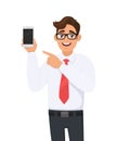Business man showing a new brand, latest smartphone screen and pointing finger. Young man holding cell, mobile phone in hand. Royalty Free Stock Photo