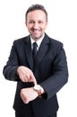 Business man showing the watch