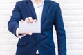 Business man showing white paper. Man wearing blue suit and hol Royalty Free Stock Photo