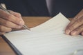 Business man signing a contract. Owns the business sign personally, director of the company, solicitor. Real estate agent holding Royalty Free Stock Photo