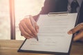 Business man signing a contract. Owns the business sign personally, director of the company, solicitor. Real estate agent holding Royalty Free Stock Photo