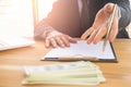 Business man signing a contract. Owns the business sign personally, director of the company, solicitor. Real estate agent holding Royalty Free Stock Photo