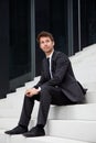 Business man siting on stairs Royalty Free Stock Photo