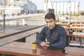 Business man sitting in a bar pointing at his watch looks disgusted at the camera. Royalty Free Stock Photo