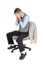 Business man sitting on chair with hands over face Royalty Free Stock Photo