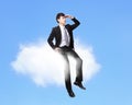 Business man sitting on a cloud Royalty Free Stock Photo