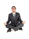 Business man sitting on floor doing yoga Royalty Free Stock Photo