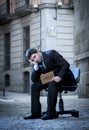 Business Man sitting on Office Chair on Street in stress Royalty Free Stock Photo