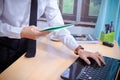 Business man sitting using laptop with blank screen on desk in office at home Royalty Free Stock Photo