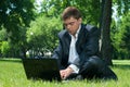 Business man sleeping on the job at a laptop Royalty Free Stock Photo