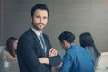 Business man smart and handsome standing with team mates working in meeting room at office