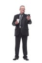 Business man with smartphone drink coffee and look at camera Royalty Free Stock Photo