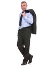 Business man smiles with jacket over shoulder Royalty Free Stock Photo