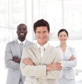 Business man smiling in front of Business team Royalty Free Stock Photo