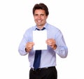Business man smiling and showing you a card Royalty Free Stock Photo