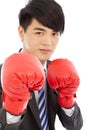 Business man sneer and ready to fight with boxing gloves