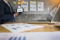 Business man speaker giving a talk finance profit graph presentation meeting audience in the conference modern office at board br Royalty Free Stock Photo