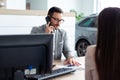 Business man speaking on the phone while in a meeting Royalty Free Stock Photo