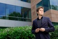 Business man standing in front of office building Royalty Free Stock Photo