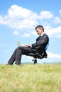 Business man standing on laptop Royalty Free Stock Photo