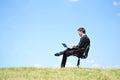 Business man standing on laptop Royalty Free Stock Photo