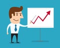 Business man standing pointing at chart growing graph