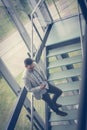 Business man standing on the stairs of business building. Busine Royalty Free Stock Photo