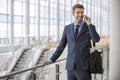 Business man standing walking talking on his cell phone Royalty Free Stock Photo