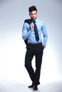 Business man stands with jacket on shoulder Royalty Free Stock Photo