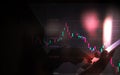 business man or stock trader analyzing stock graph chart by fibonacci indicator