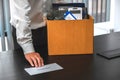 Business man stressing with resignation letter for quit a job packing the box and leaving the office Royalty Free Stock Photo