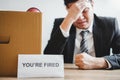 Business man stressing with resignation letter for quit a job packing the box and leaving the office , Resignation concept Royalty Free Stock Photo