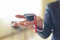 Business man or student with graduation cap on hand in day graduation congratulated the graduates in University - Graduation Royalty Free Stock Photo