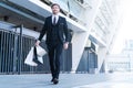 Successful business man in a stylish suit go shopping. Royalty Free Stock Photo