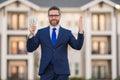 Business man in suit with cash money dollars banknotes outdoor. Hundred dollar bill, financial concept. Real estate Royalty Free Stock Photo