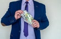 Business man in suit holding euro and dollar banknote for exchange rate Royalty Free Stock Photo