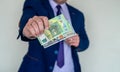 Business man in suit holding euro and dollar banknote for exchange rate Royalty Free Stock Photo