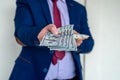 Business man in suit holding euro and dollar banknote for exchange rate Royalty Free Stock Photo