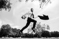 Business man in suit jumping over urban park. Portrait of successful businessman. Fast business concept. Royalty Free Stock Photo