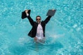 Business man in suit and laptop splash water in swimming pool. Crazy summer business vacation. Funny excited amazed Royalty Free Stock Photo