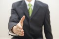 Business man in suit offers to shake hands Royalty Free Stock Photo