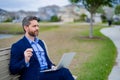 Business man in suit sitting on bench. Business man on bench in park outdoors. Thinking about business. Thoughtful Royalty Free Stock Photo