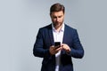 Business man in suit talking on phone, promo mobile app. Businessman in casual clothes using smartphone isolated on Royalty Free Stock Photo