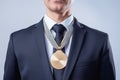 Business man in suit wearing gold medal, successful employee concept, generative AI