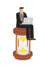 Business man in a suit working with a laptop computer on top of a hour glass. Concept of an entrepreneur working fast fighting for