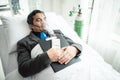 Business man with suit working with oxygen mask in the office. Sick man work in the office Royalty Free Stock Photo