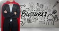 Business man superhero opening shirt against grey wall with business doodles and flare Royalty Free Stock Photo